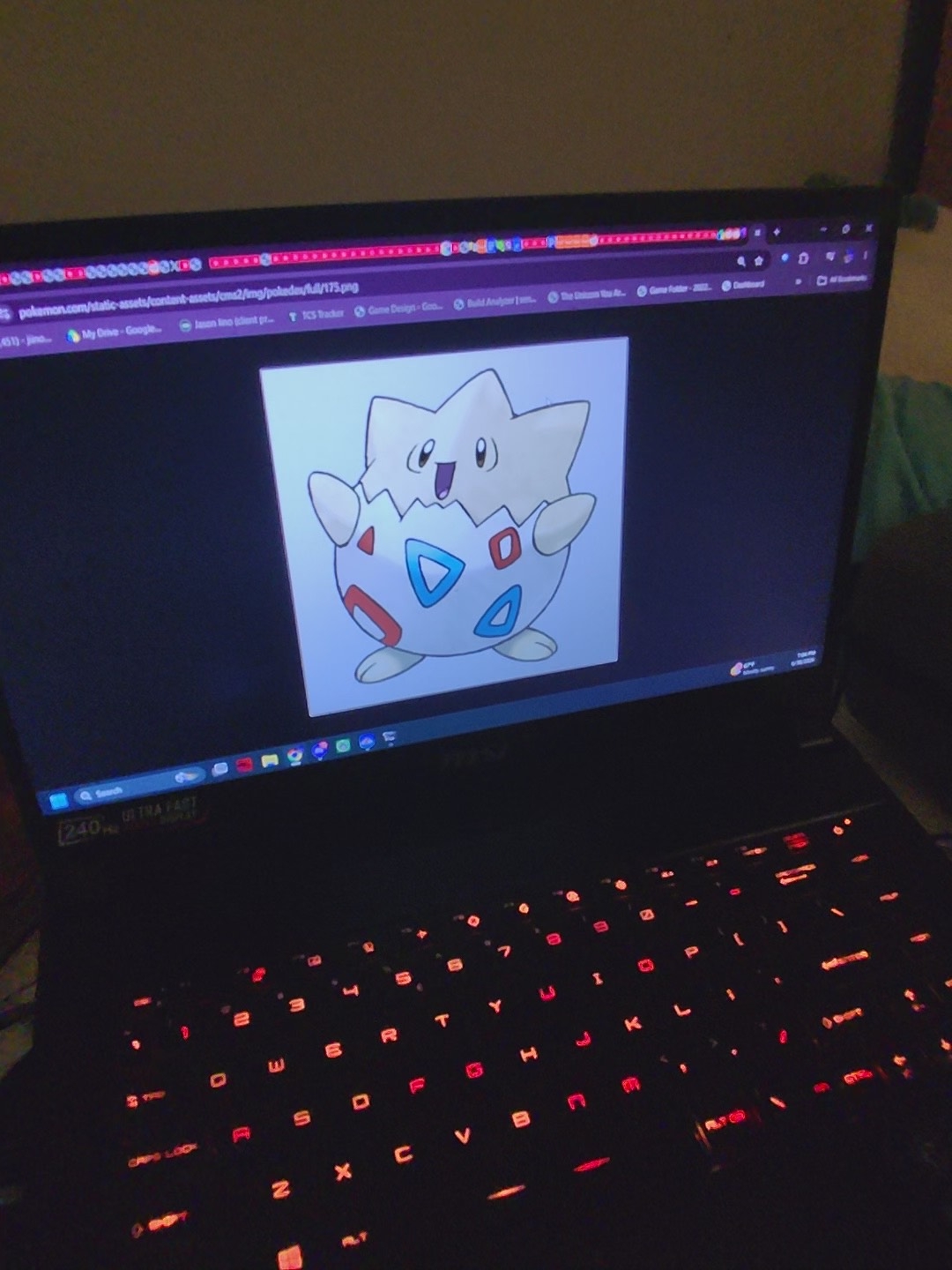Togepi smiling on a laptop screen
